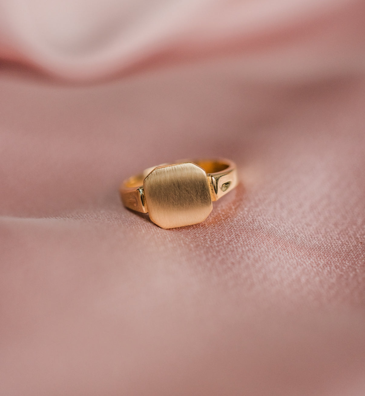 Maggie’s pinky signet ring